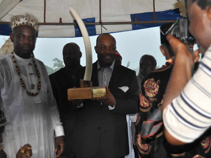 Gov. Godswill Akpabio is presented with an elephant tusk by the Abak Council of Chiefs at the reception for Uwem Udoma and Aniekan Umanah at Technical College, Abak