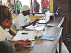 Members of Nigerian Youth Service Corps (NYSC) performing voter registration on behalf of INEC in January 2011 for the creation of voter register towards the general election in April 2011