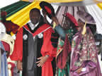 Vice Chancellor of the University of Uyo, Prof. Comfort Ekpo, decorates Sen. Udoma Udo Udoma for the award of Honourary Doctor of Law at UNIUYO convocation grounds during the 17th and 18th convocation ceremonies of the institution on Saturday 22nd October