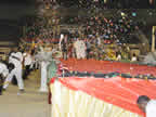 Christmas crackers and bangers rend the air as Akwa Ibom State governor, Chief (Dr.) Godswill Akpabio, is heralded to declare the event open at the 2009 Carol Night with the largest group of carol singers in the world 